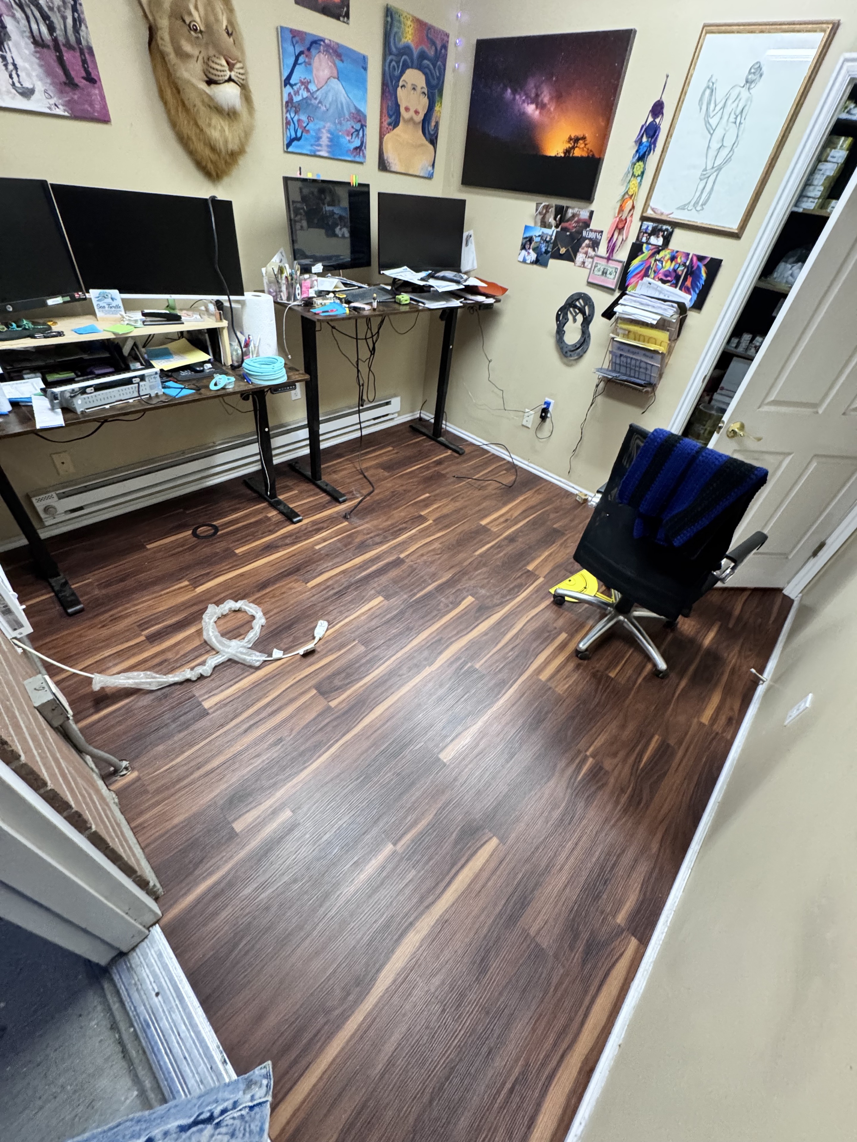 Completed dark wood-look flooring in an office