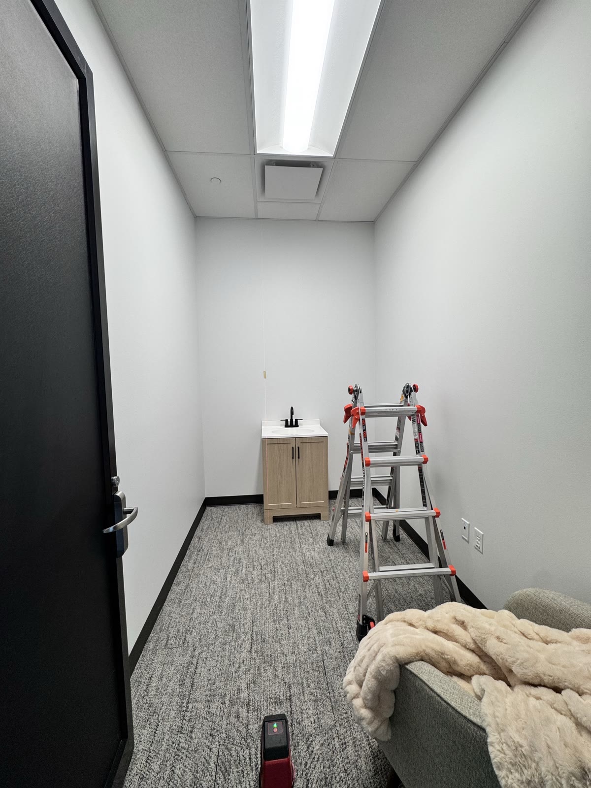 Second Draper corporate-office mother's room before wallpaper installation