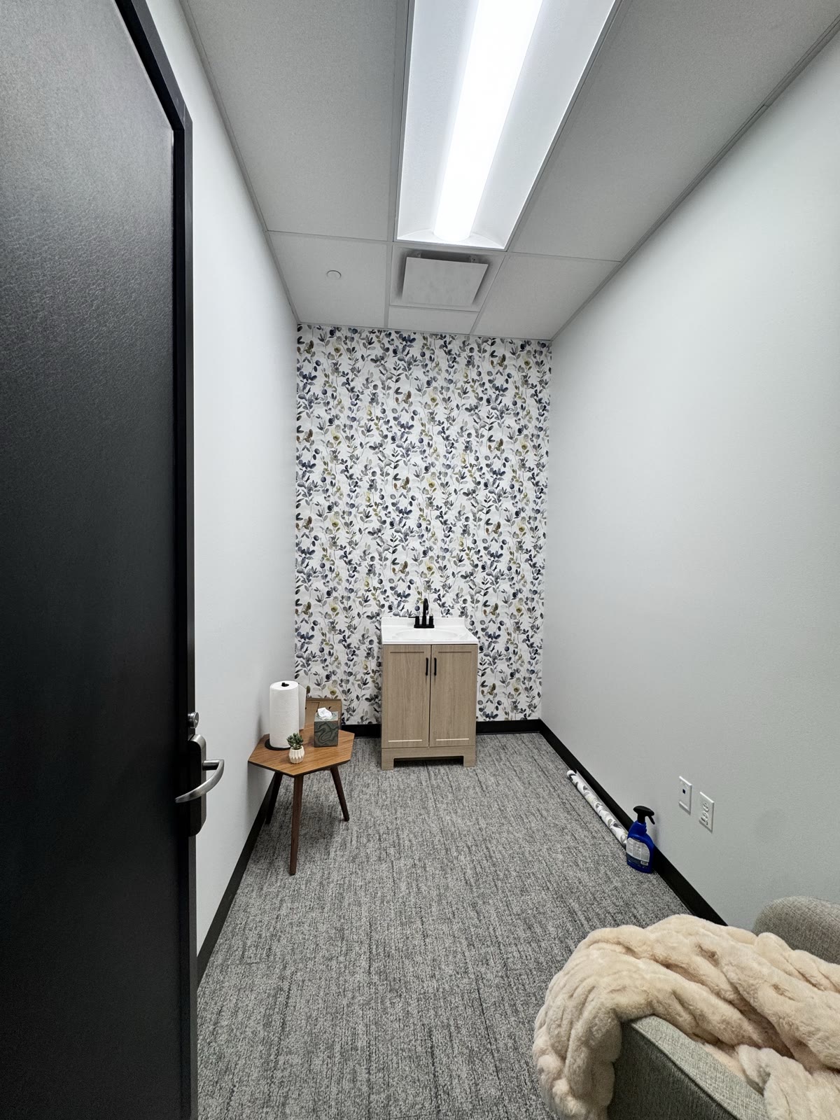 Botanical wallpaper installed in a Draper corporate-office mother's room